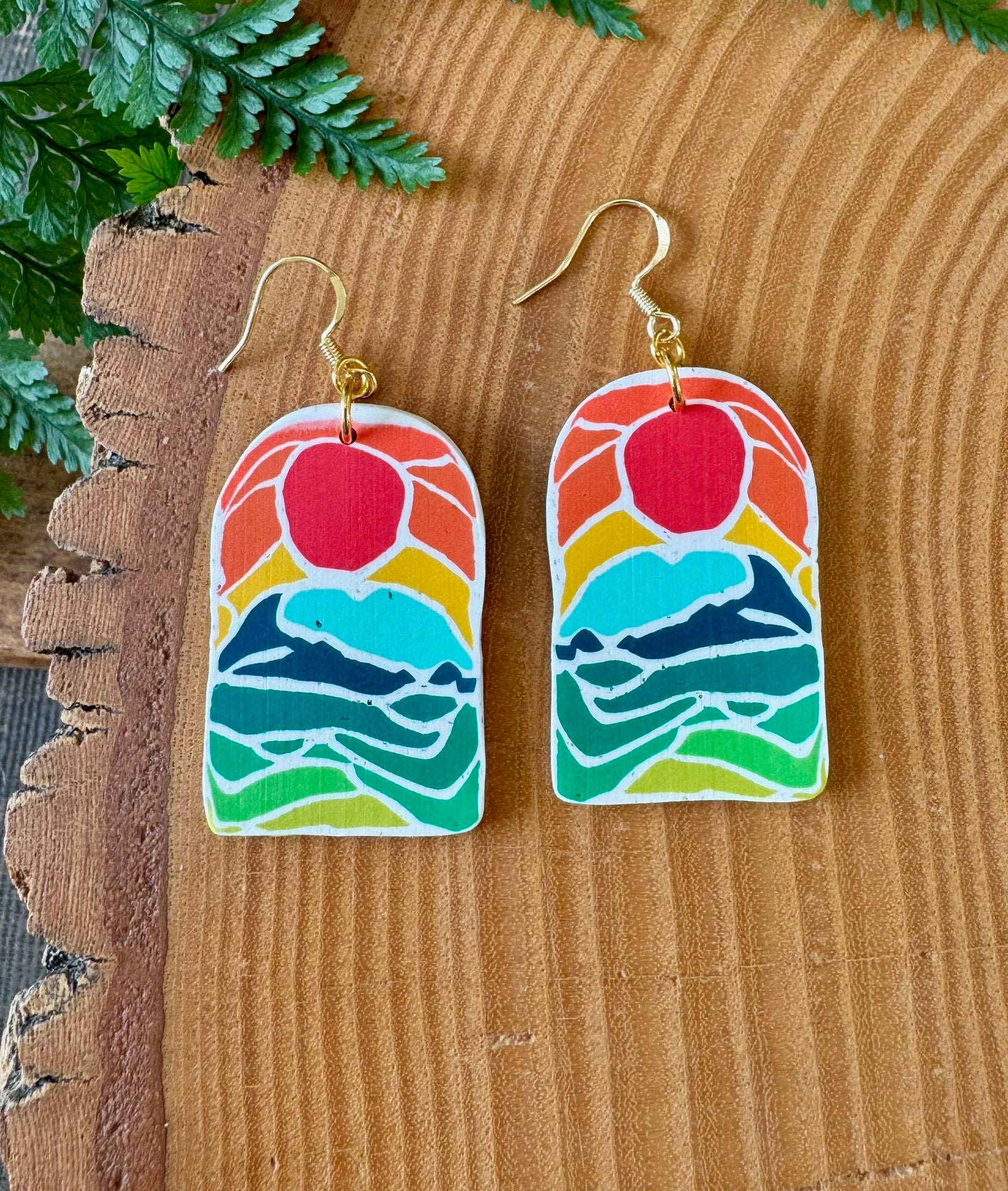 Earrings with sunrise picture on, all made from polymer clay