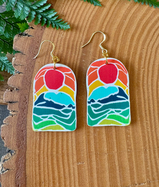 Earrings with sunrise picture on, all made from polymer clay